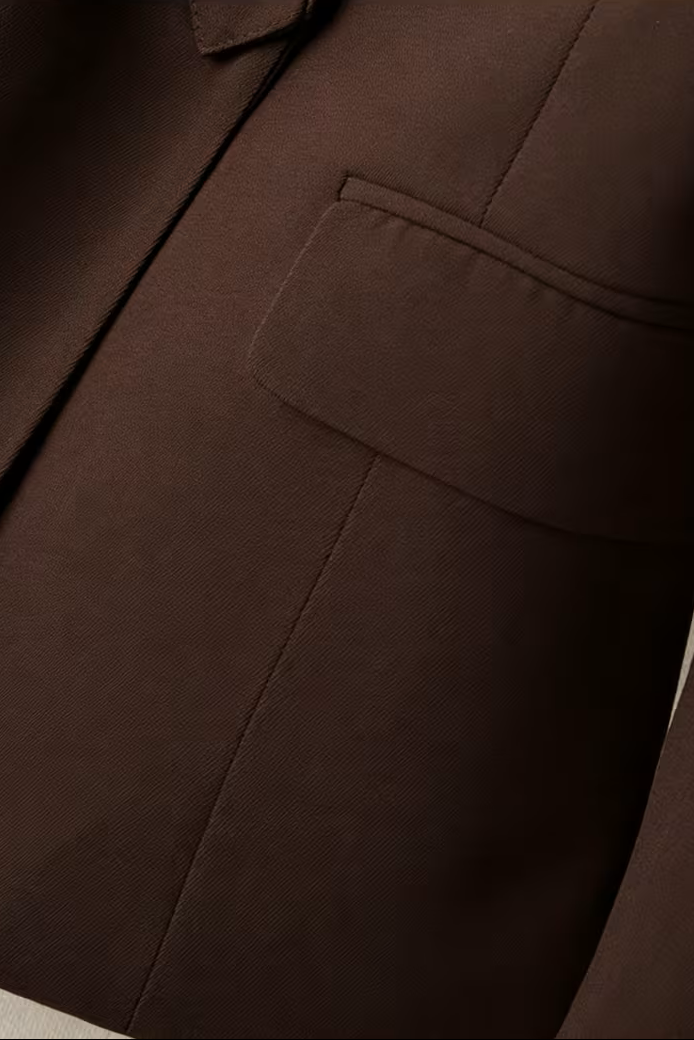 Tailored women's blazer from Christine Brewer featuring a fitted design, lapel collar, and classic style for professional or casual wear.