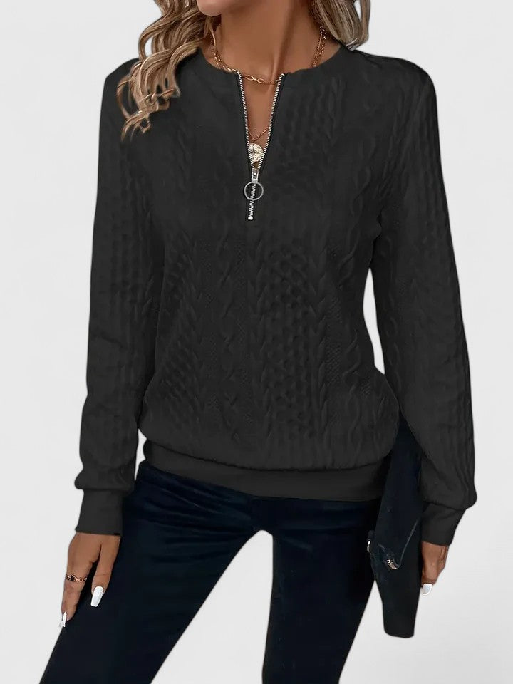 Women’s knit sweater by Christine Brewer, featuring a cozy, textured design in neutral tones, worn by a model with long hair.
