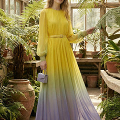Christine Brewer high waisted maxi dress with long sleeves, belted, contrast color gradient, pleated, split-joint, round-neck design.