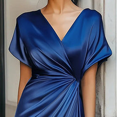 Loose short sleeve evening dress by Christine Brewer featuring an asymmetric solid color design and V-neck split-joint style.