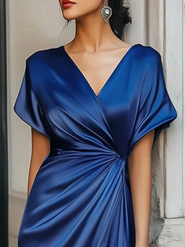 Loose short sleeve evening dress by Christine Brewer featuring an asymmetric solid color design and V-neck split-joint style.