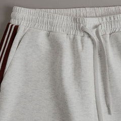 Retro sporty grey and white sleeveless sweatshirt and shorts set by Christine Brewer, perfect for casual activewear.
