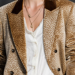 Khaki leopard print velvet blazer by Christine Brewer, featuring color-block design and tailored fit, displayed on a hanger.