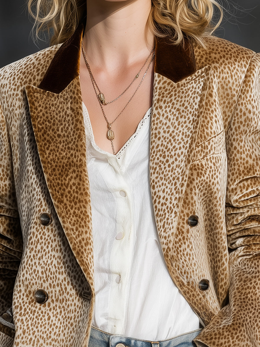 Khaki leopard print velvet blazer by Christine Brewer, featuring color-block design and tailored fit, displayed on a hanger.