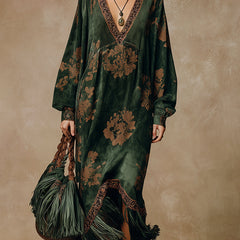 Green faux suede tassel maxi dress for women by Christine Brewer, featuring a flowing silhouette and tassel details.
