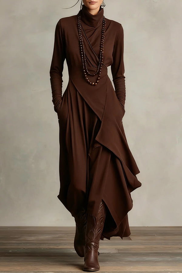 Solid color high-neck long-sleeved irregular casual maxi dress by Christine Brewer, shown hanging on a plain background.