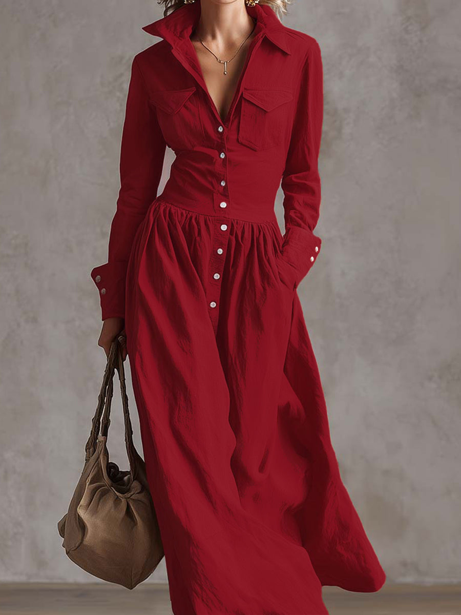 Christine Brewer high waisted maxi dress with long sleeves, buttoned front, pleated pockets, split-joint lapel in solid color.