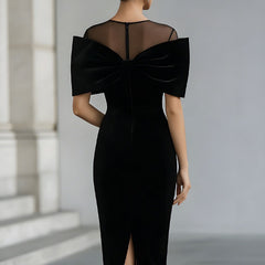 Black velvet bow midi dress for women by Christine Brewer, featuring a fitted silhouette and elegant mid-length design.