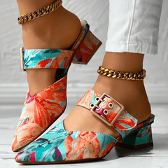 Bright rainbow-colored orthopedic heels for women by Christine Brewer, designed for comfort and stylish support.