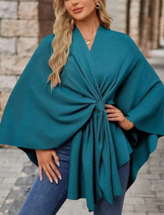 Christine Brewer Cecilia knit poncho for women, stylish and cozy top with a soft, textured fabric in neutral tones.