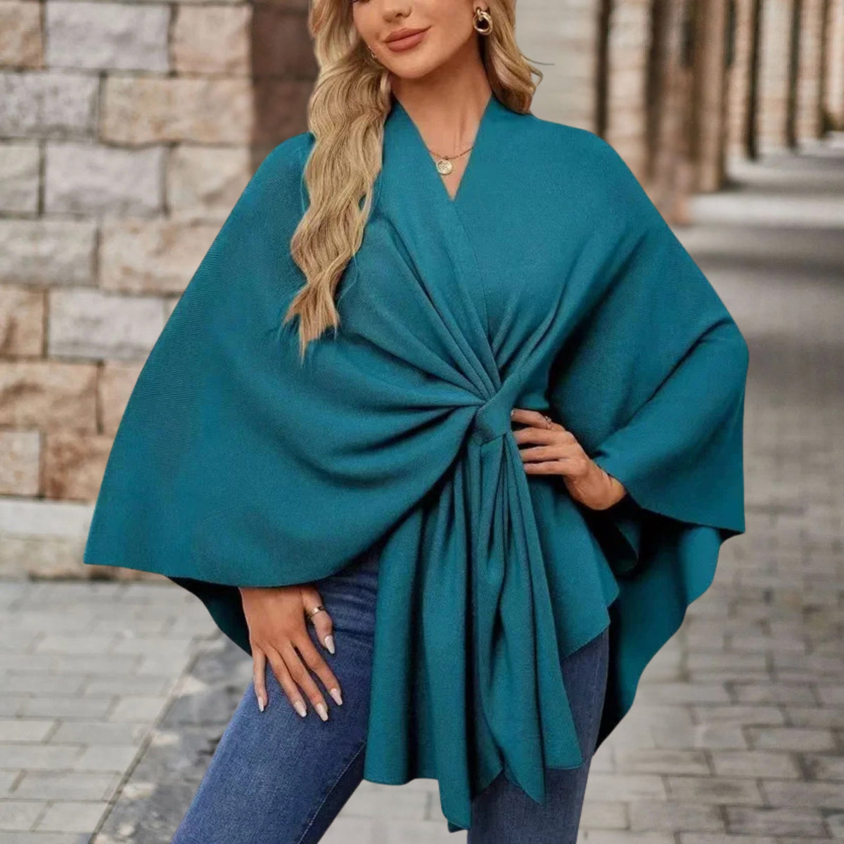 Christine Brewer Cecilia knit poncho for women, stylish and cozy top with a soft, textured fabric in neutral tones.