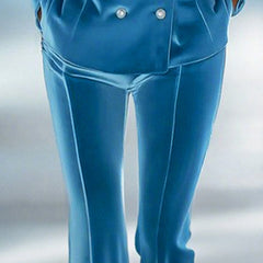 Blue loose velvet flared women's trousers by Christine Brewer, showcasing relaxed fit and stylish flare design.