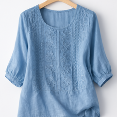 White floral blouse for women from Christine Brewer's Isla collection, featuring delicate floral patterns and a stylish fit.