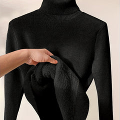 Christine Brewer Peyton women's turtleneck sweater in cozy knit fabric, shown in a close-up of the textured beige material.