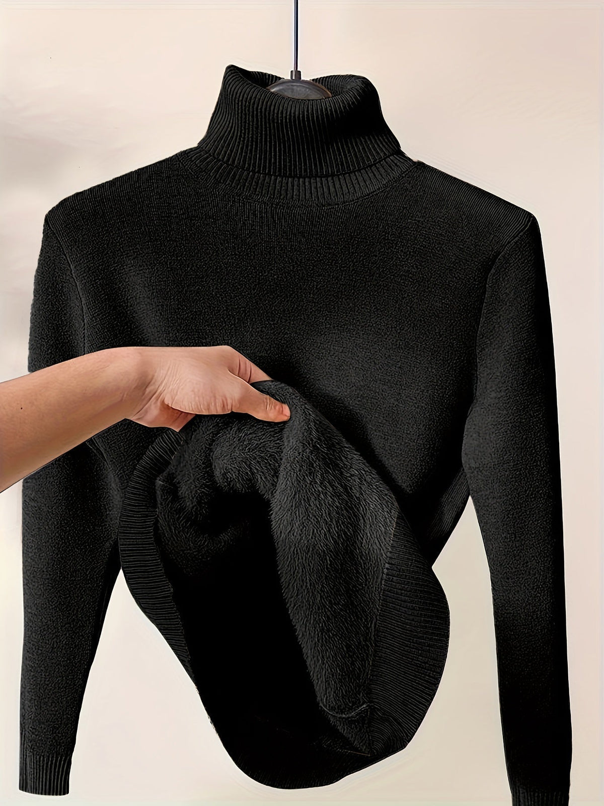 Christine Brewer Peyton women's turtleneck sweater in cozy knit fabric, shown in a close-up of the textured beige material.