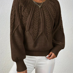 Christine Brewer Naomi classic timeless sweater in cozy knit, featuring a round neckline and long sleeves, worn in a casual setting.