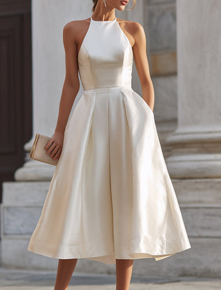 Christine Brewer halter-neck pleated midi dress for women, stylish dress with flowing pleats and a flattering fit.