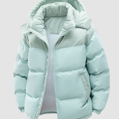 Cora Cosy Puffer Jacket for Women by Christine Brewer, navy blue, insulated winter coat with a hood and quilted design.