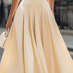 Cream sleeveless turtleneck pleated midi dress for women by Christine Brewer, showing the elegant design and flowy fabric.