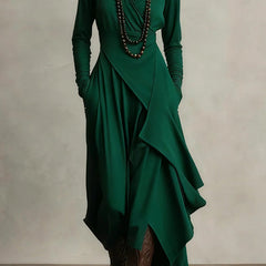 Christine Brewer solid color high-neck long-sleeved irregular casual maxi dress displayed on a hanger.
