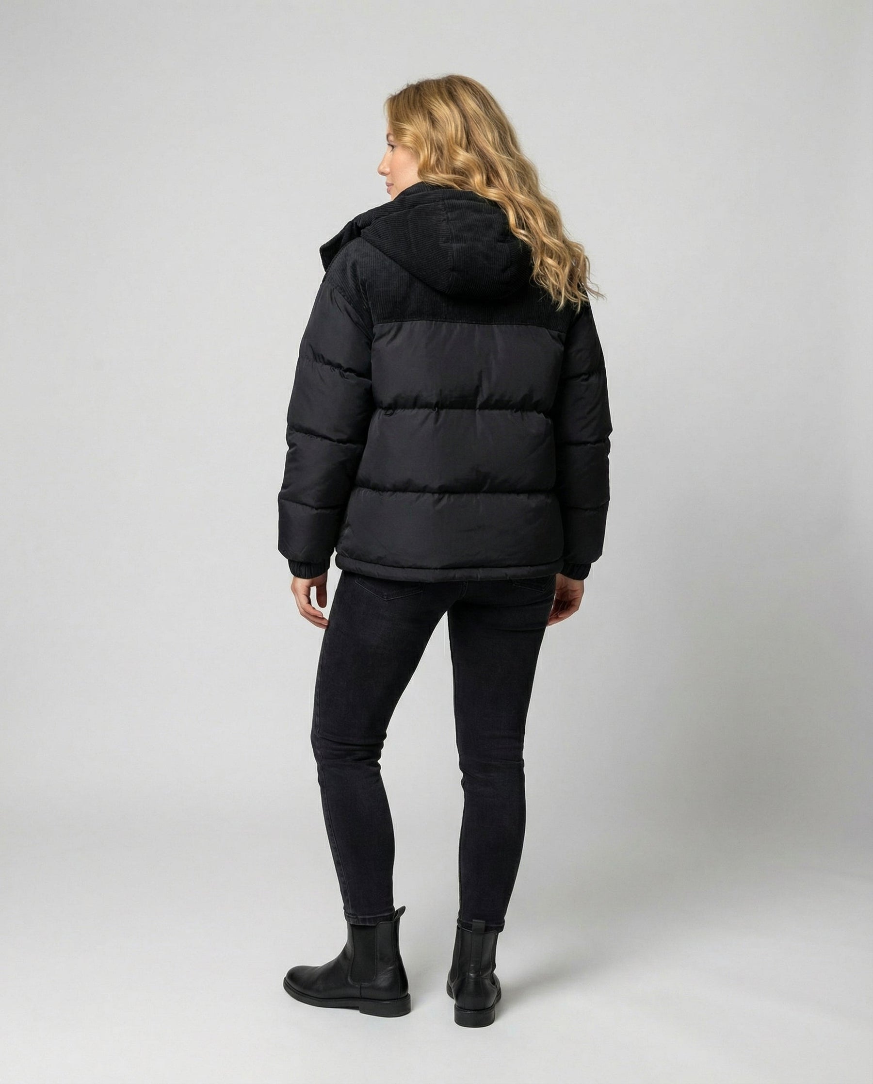 Back view of Christine Brewer Cora cosy puffer jacket for women, showcasing quilted design and warm, stylish winter outerwear.