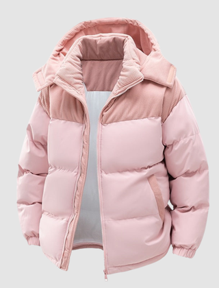 Light pink Cora Cosy Puffer Jacket for Women by Christine Brewer, shown on a hanger with a close-up of the quilted design.