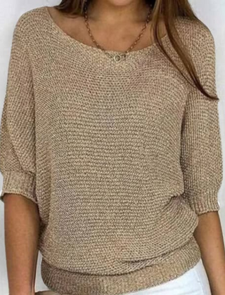 Christine Brewer Bianca women's knit sweater displayed on a hanger, featuring a cozy, textured knit pattern in neutral tones.