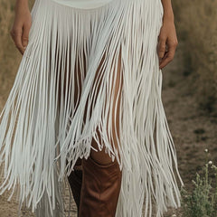 White suede tassel dress by Christine Brewer, casual style with tassel details, showcasing the dress's soft texture and flowing design.