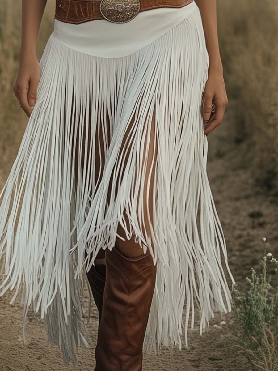 White suede tassel dress by Christine Brewer, casual style with tassel details, showcasing the dress's soft texture and flowing design.