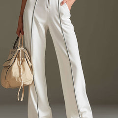 White cotton blend short sleeve wide-leg jumpsuit for women by Christine Brewer, featuring a comfortable, stylish design.