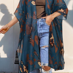 Plus size Christine Brewer kimono cardigan with open front, side slits, semi-sheer fabric, layered over tops.