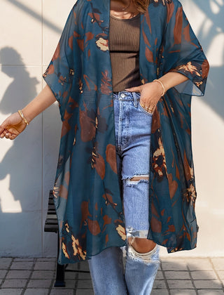 Plus size Christine Brewer kimono cardigan with open front, side slits, semi-sheer fabric, layered over tops.