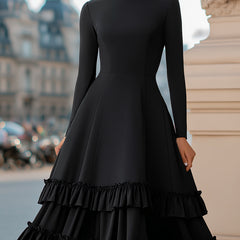 Black high-neck A-line tiered ruffle midi dress by Christine Brewer, featuring elegant layered design and feminine ruffle details.