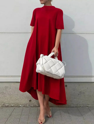 White high-low maxi dress with short sleeves by Christine Brewer, featuring a solid color design and flowing silhouette.