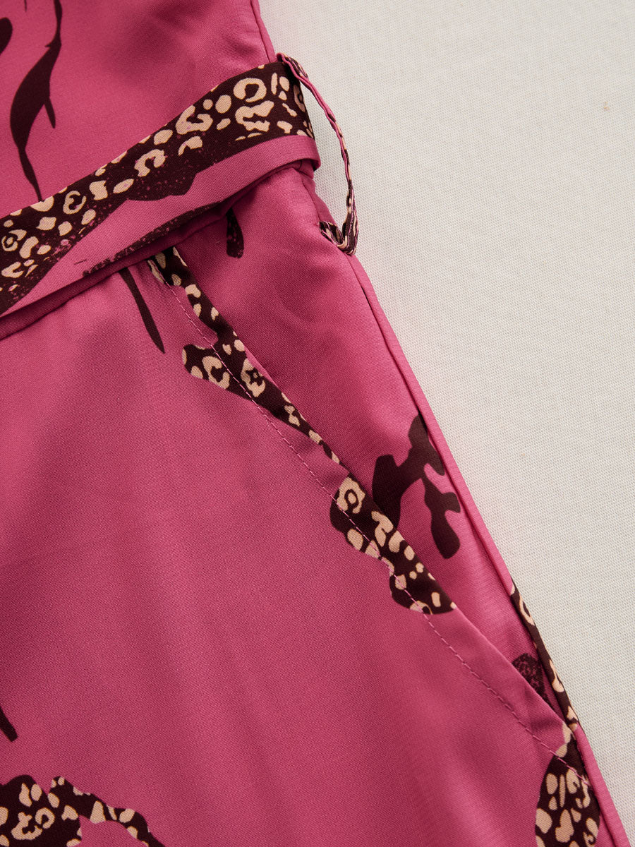 Rose red leopard print chiffon jumpsuit with long sleeves, stylish women's pants by Christine Brewer.