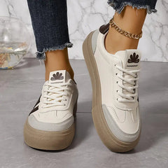 Elegant striped flowy sneakers for women by Christine Brewer, featuring a stylish design and comfortable fit.