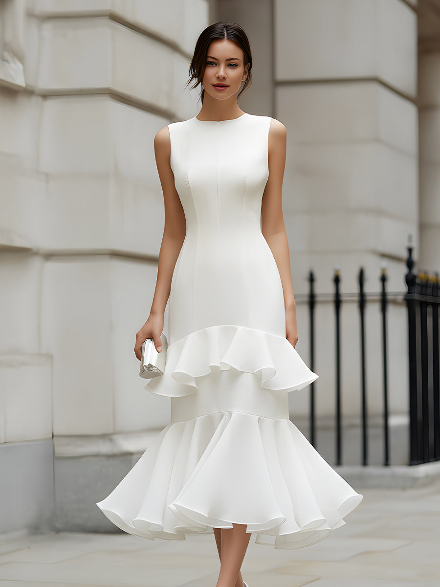 Christine Brewer sleeveless tiered ruffle midi dress hanging on a wooden hanger, showcasing its flowy, layered design and ruffle details.