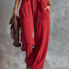 Raspberry red cotton hooded zip-front jumpsuit for women with pants style by Christine Brewer, featuring a casual and comfortable design.