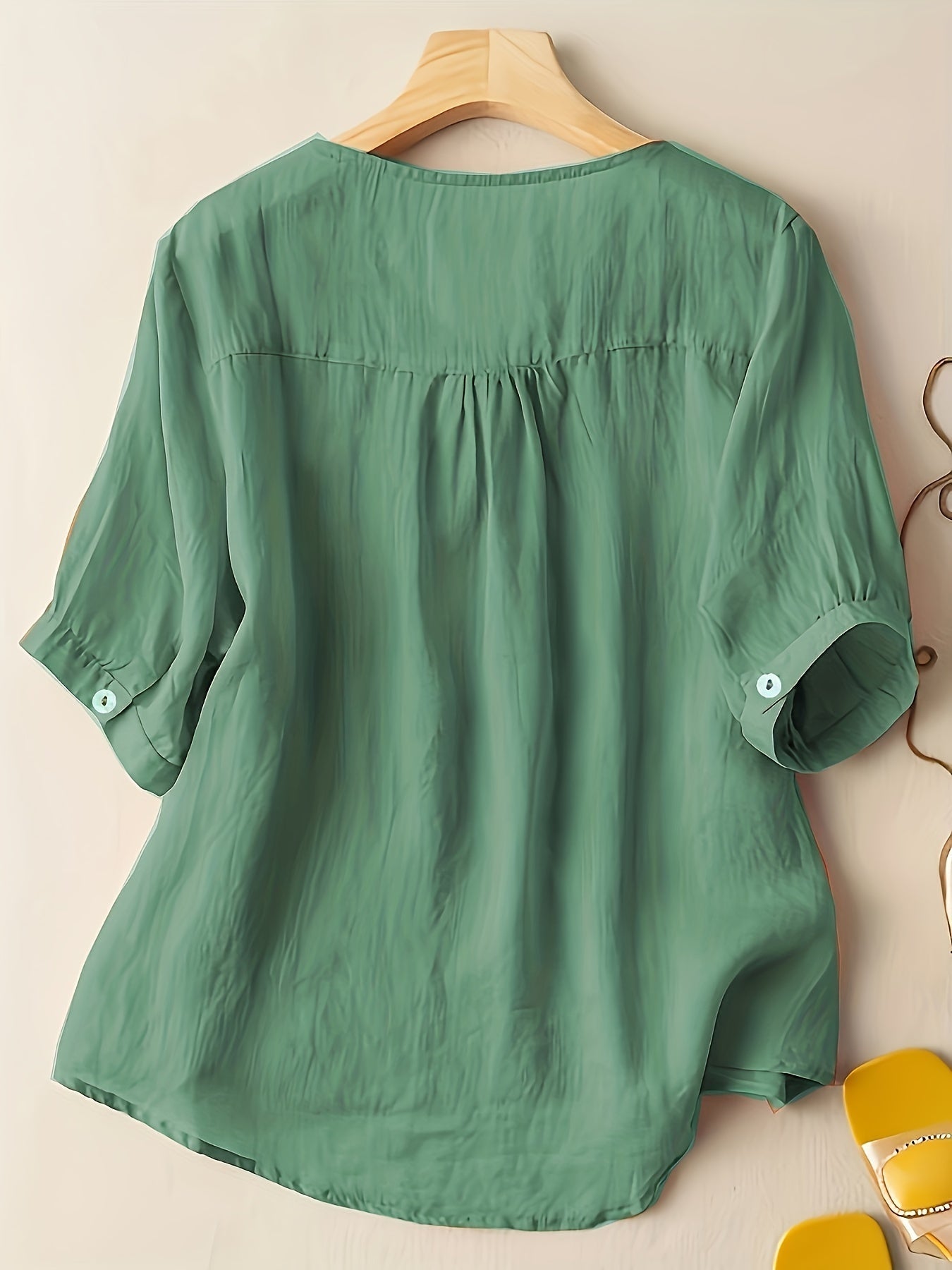 Women’s summer blouse by Christine Brewer featuring a V-neck, linen fabric, and a flowy, casual fit.