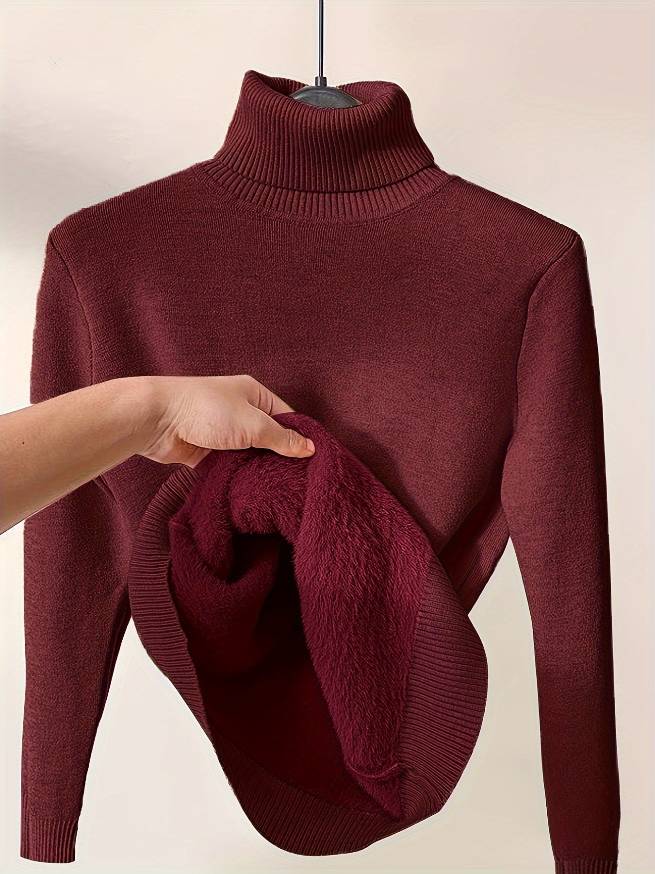 Christine Brewer Peyton women's turtleneck sweater, cozy knit in neutral color, close-up view of the stylish, ribbed turtleneck design.