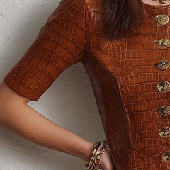 Caramel croc-embossed faux leather midi dress by Christine Brewer, showing a stylish dress with textured crocodile pattern.