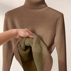 Women’s Peyton turtleneck sweater by Christine Brewer in cozy knit, shown in a neutral color with a close-up of the fabric texture.