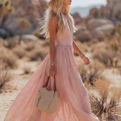 Sleeveless cotton maxi dress for women by Christine Brewer, featuring a flowing design and sleeveless style for warm weather.