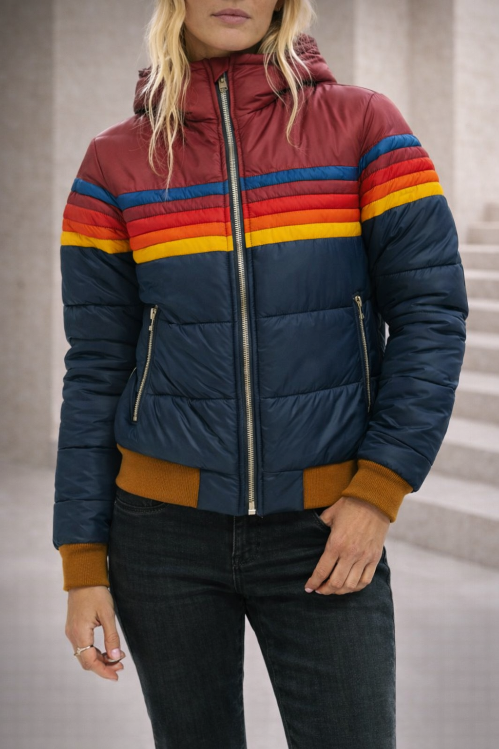 Christine Brewer Clara hooded quilted puffer jacket for women, featuring a padded design and a hood, displayed on a hanger.