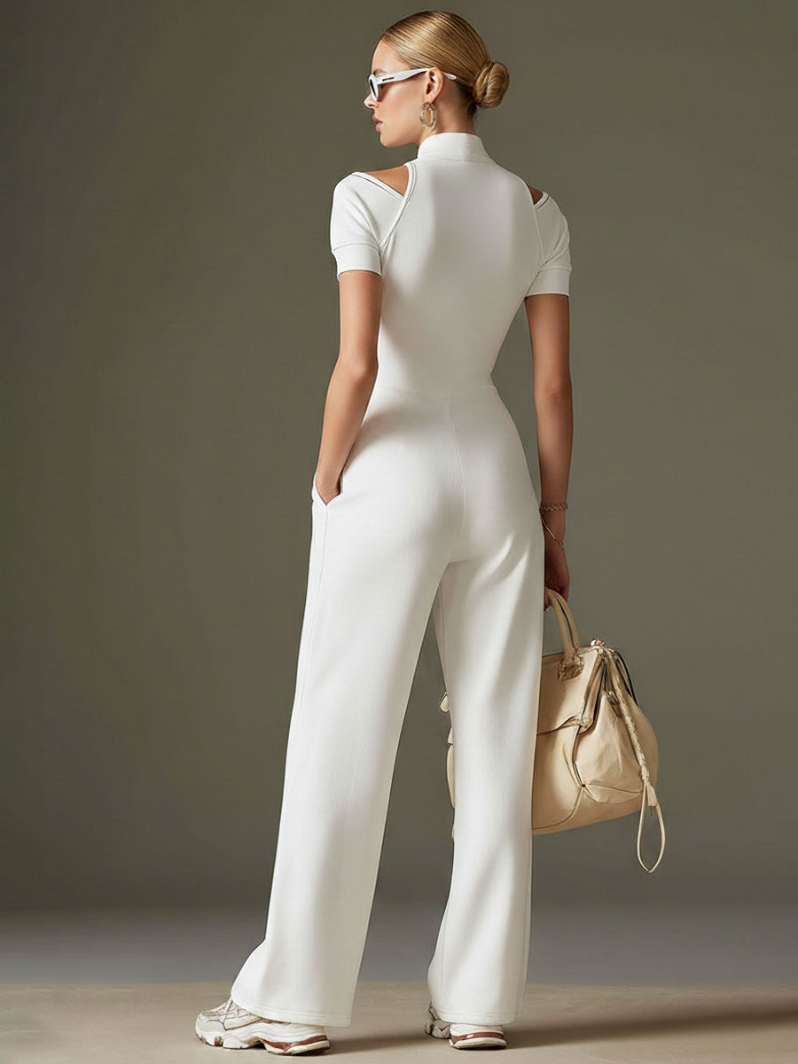Women’s white cotton blend short sleeve wide-leg jumpsuit, stylish and comfortable pants by Christine Brewer, shown on a model.