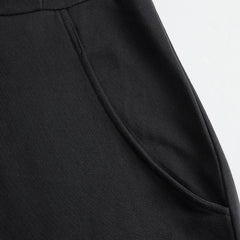 Black striped sleeveless hooded jumpsuit for women by Christine Brewer, featuring a relaxed fit and stylish design.