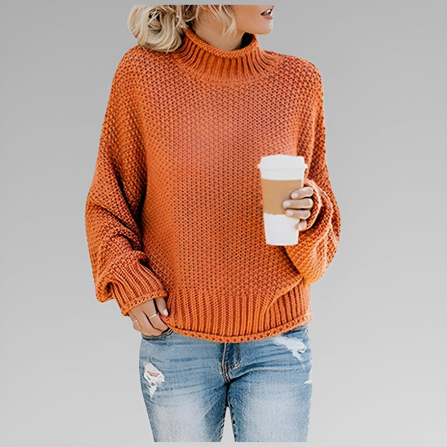 Amy Winifred ribbed orange sweater for women by Christine Brewer, showcasing a cozy, fitted sweater with textured ribbing.