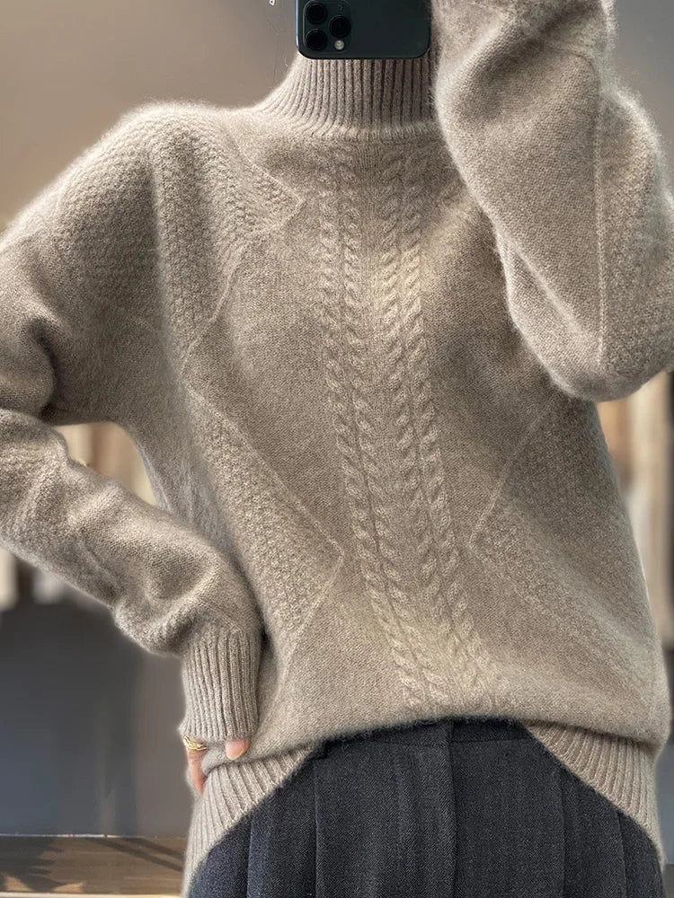 Christine Brewer Selena cable knit turtleneck sweater for women, showing the cozy, textured knit pattern and high turtleneck design.