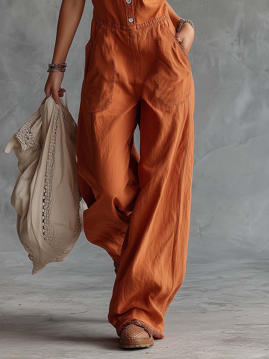 Rust orange cotton Western V-neck sleeveless jumpsuit for women, featuring pants style and a relaxed fit by Christine Brewer.