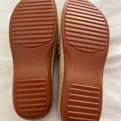A pair of Christine Brewer Adele orthopedic wedge heel sandals for women, featuring comfortable strap design and neutral color.